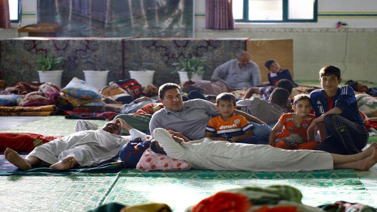 نزوح 100 ألف مسيحي بعد هجوم مسلحين على مناطقهم في الموصل (فيديو)