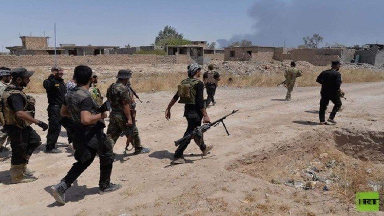 قوات الحشد الشعبي تعلن تحرير مركز قضاء بيجي ومنطقة البو جواري .. صور