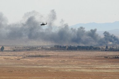 مروحية "التمساح" Ka -52 في أثناء العمليات القتالية في محيط مدينة القريتين التي تم تحريرها من براثن المسلحين.
