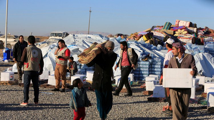 مقتل 11 مدنيا بينهم عمال إغاثة بهجومين في الموصل