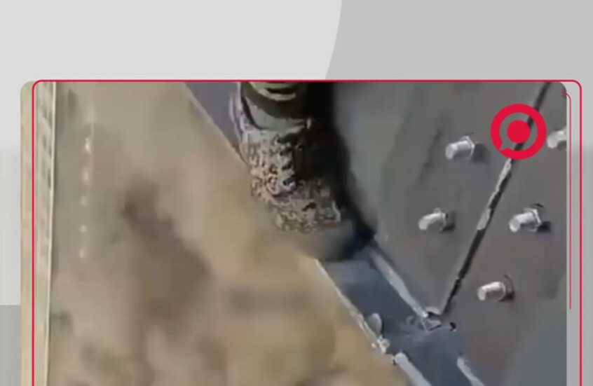 عمال صينيون في إسرائيل يوثقون لحظة تصاعد الدخان من مبنى أصابه صاروخ إيراني في تل أبيب